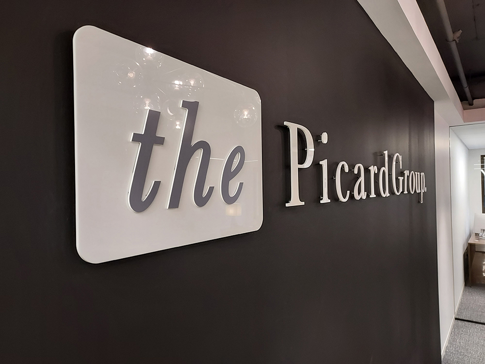 Acrylic Signs in Concord, NC designed and installed for business office walls and branded interiors
