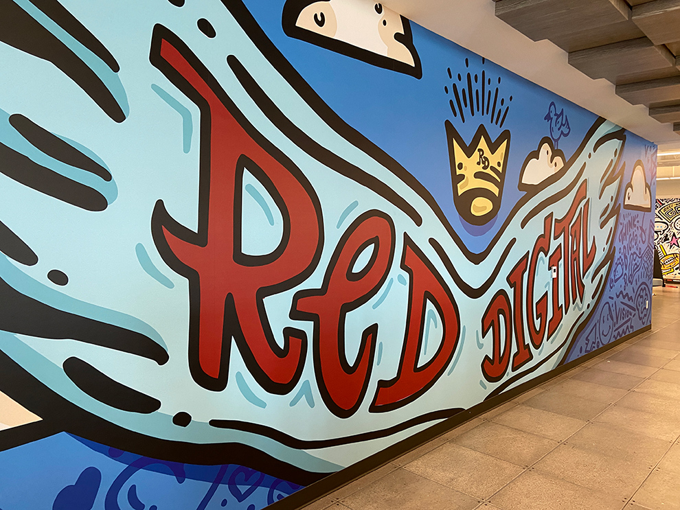 Creative workplace wall mural installation in Cary, NC office interior
