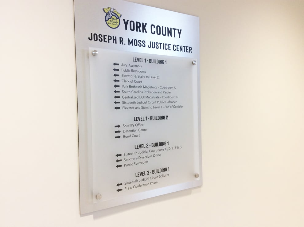 Wayfinding signs and directional graphics guiding workplace navigation in Concord, NC